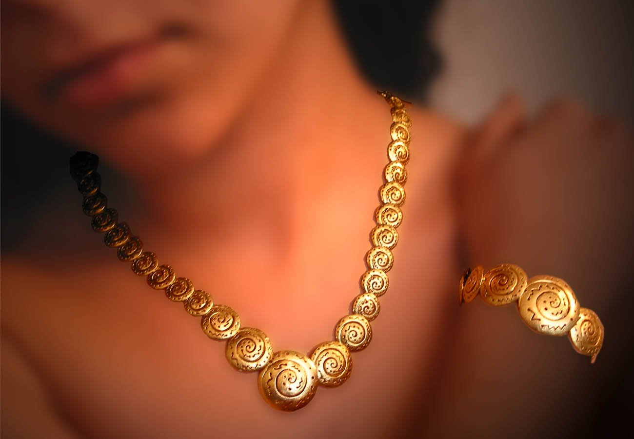 18k gold creation with repeated spiral motifs inspired from the Cycladic and Minoan civilazation