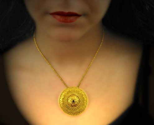 22k gold chain necklace with disk like ending, artistically decorated with specks and precious stones