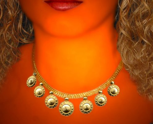 22k gold necklace with chain strap and repeated disk like motif