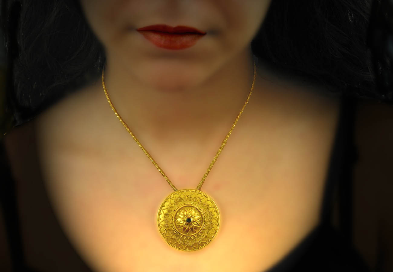 22k gold chain necklace with disk like ending, artistically decorated with specks and precious stones