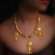 22k gold elements in the shape of vase which are hanging from discs placed in a necklace