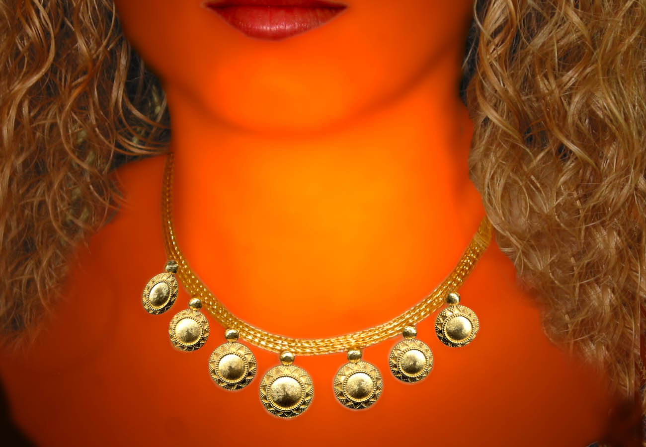 22k gold necklace with chain strap and repeated disk like motif